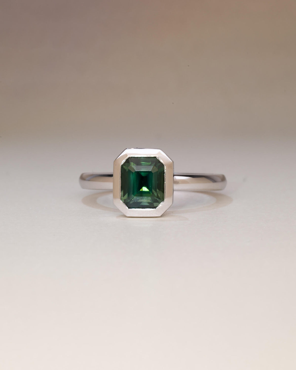 Bespoke Bella emerald cut bezel solitaire engagement ring in 9K white gold with 1.69ct Australian sapphire — handcrafted by Benjamin Rose Melbourne