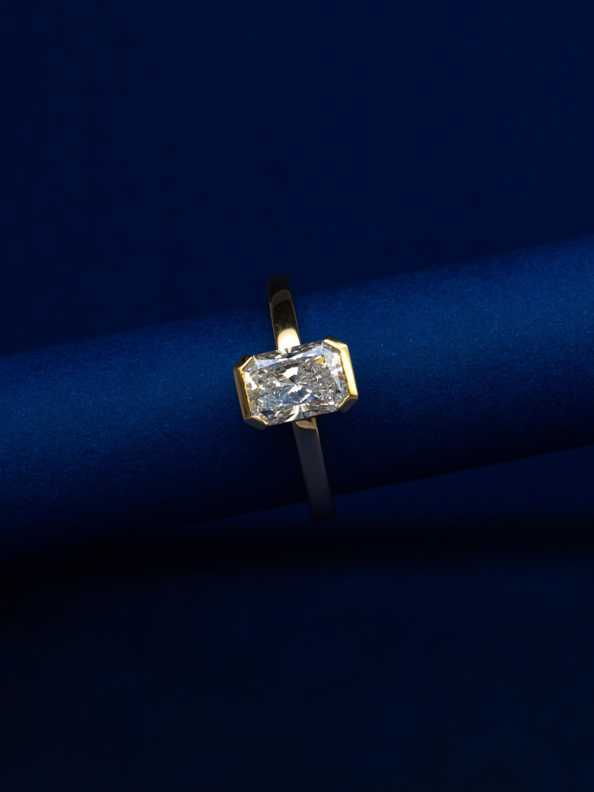 Bespoke radiant cut half bezel solitaire engagement ring in 18K yellow gold with 1.24ct natural diamond — handcrafted by Benjamin Rose Melbourne