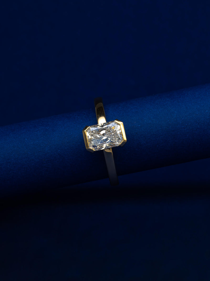 Bespoke radiant cut half bezel solitaire engagement ring in 18K yellow gold with 1.24ct natural diamond — handcrafted by Benjamin Rose Melbourne