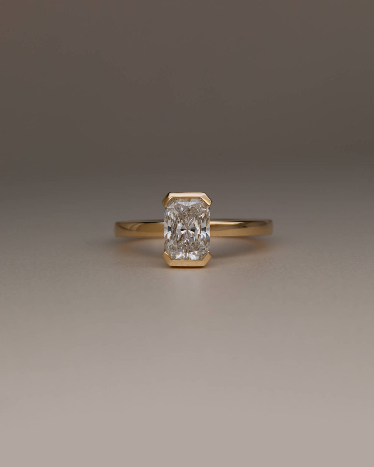 Bespoke radiant cut half bezel solitaire engagement ring in 18K yellow gold with 1.24ct natural diamond — handcrafted by Benjamin Rose Melbourne