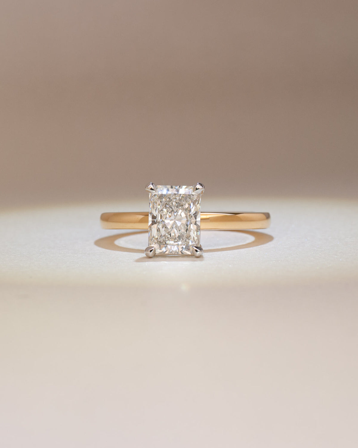 Bespoke radiant cut solitaire engagement ring with talon claw platinum setting on 18K yellow gold band — 1.50ct natural diamond, handcrafted by Benjamin Rose Melbourne