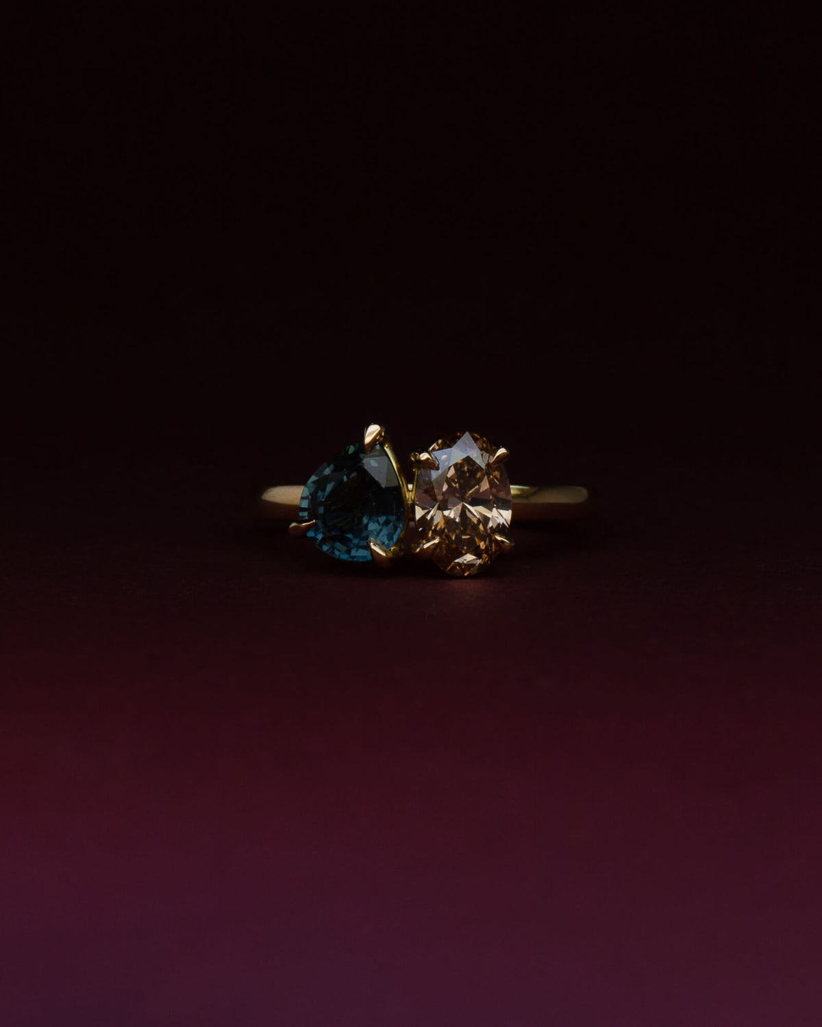 Bespoke toi et moi engagement ring in 18K yellow gold with pear Australian sapphire and oval champagne diamond — handcrafted by Benjamin Rose Melbourne