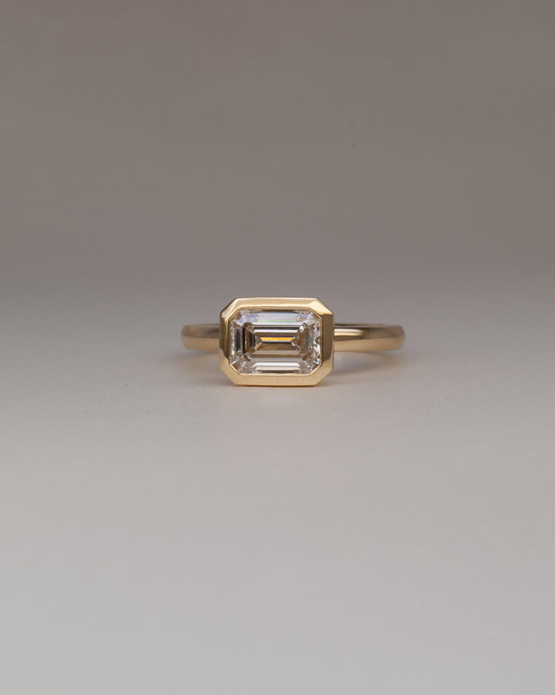 Bespoke Bella east west bezel solitaire engagement ring in 18K yellow gold with 1.55ct emerald cut lab grown diamond — handcrafted by Benjamin Rose Melbourne
