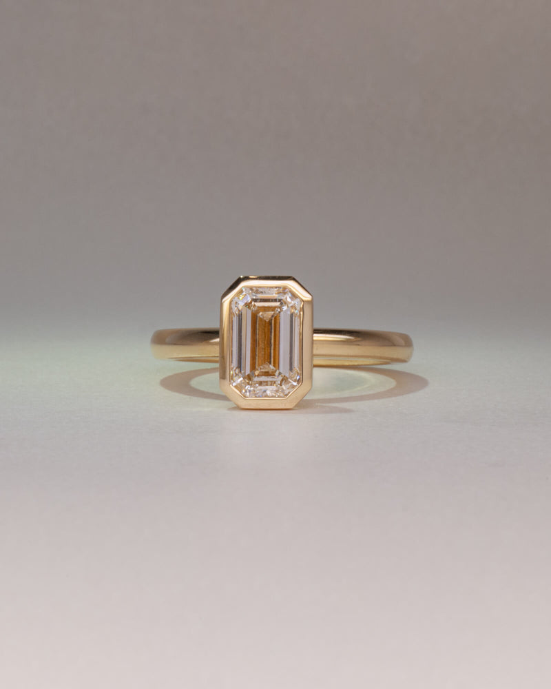 Bespoke Bella emerald cut bezel solitaire engagement ring in 18K yellow gold with 1.50ct natural diamond — handcrafted by Benjamin Rose Melbourne