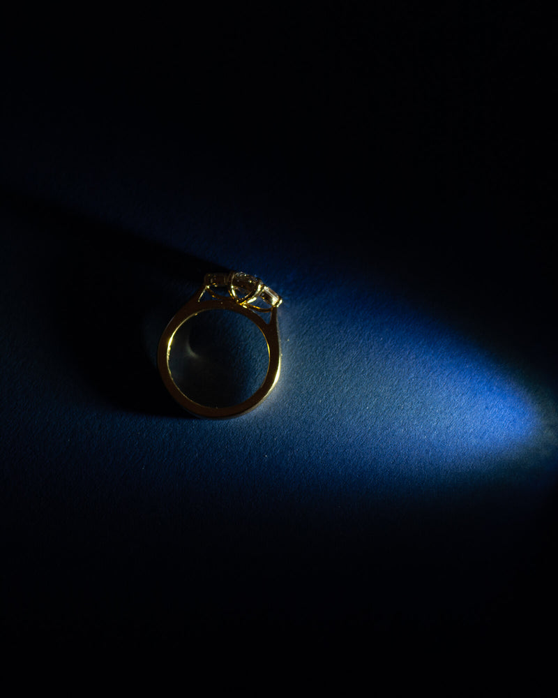 Bespoke Bianca trilogy engagement ring in 18K yellow gold with 0.56ct round brilliant lab diamond and lab diamond side stones — handcrafted by Benjamin Rose Melbourne