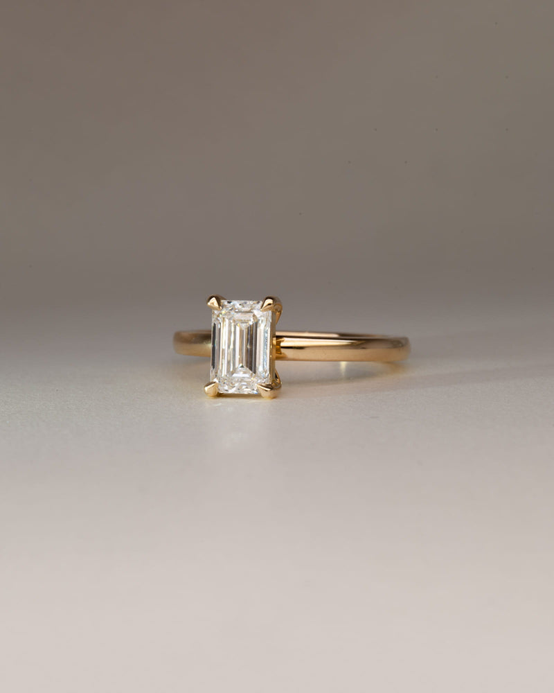Bespoke emerald cut diamond solitaire engagement ring in 18K yellow gold — 1.29ct natural diamond, handcrafted by Benjamin Rose Melbourne