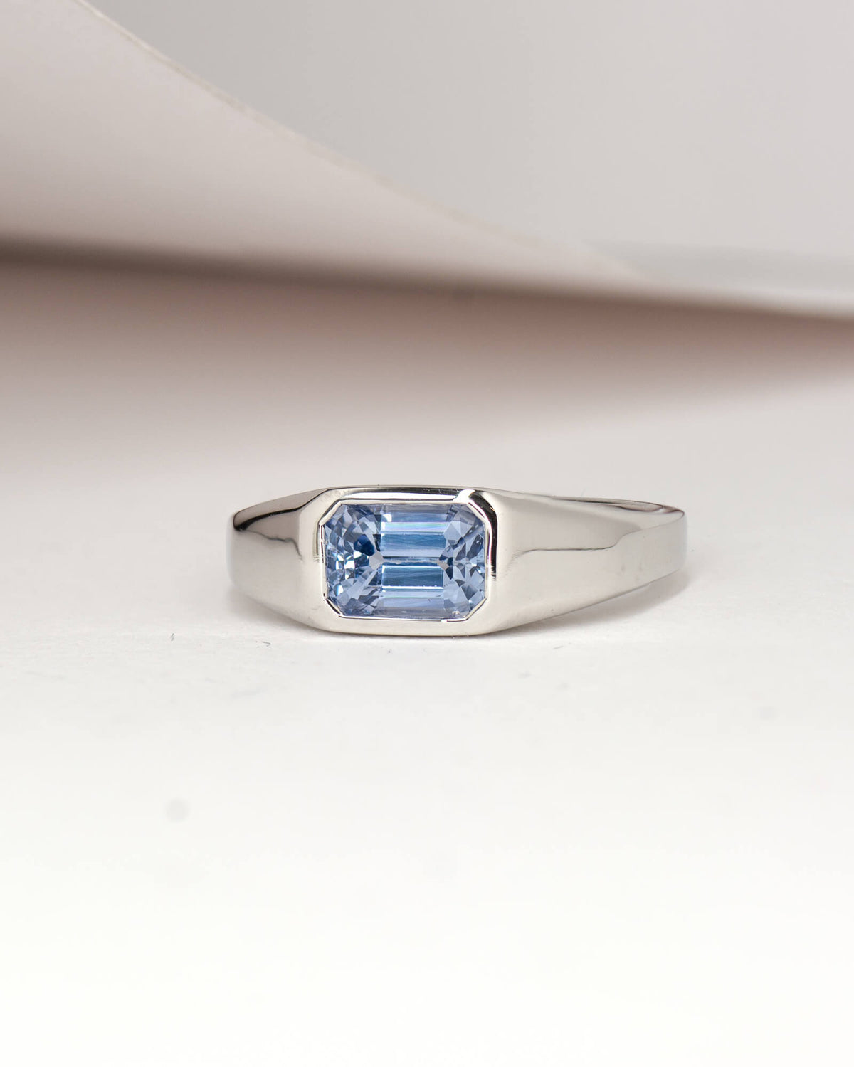 Bespoke emerald cut sapphire signet engagement ring in 18K white gold with 1.68ct Ceylon sapphire — handcrafted by Benjamin Rose Melbourne