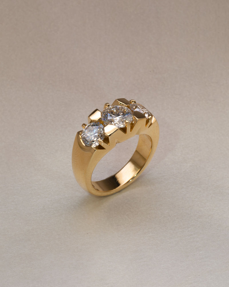 Bespoke Nika three stone engagement ring in 18K yellow gold with 1.21ct round brilliant lab diamond and 0.71ct lab diamond side stones — handcrafted by Benjamin Rose Melbourne