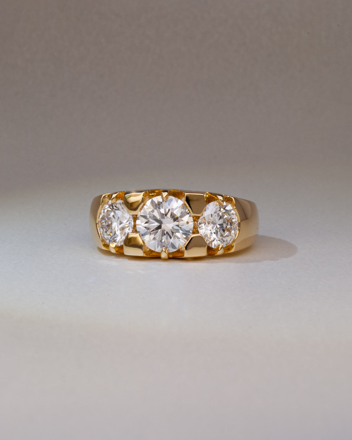 Bespoke Nika three stone engagement ring in 18K yellow gold with 1.21ct round brilliant lab diamond and 0.71ct lab diamond side stones — handcrafted by Benjamin Rose Melbourne