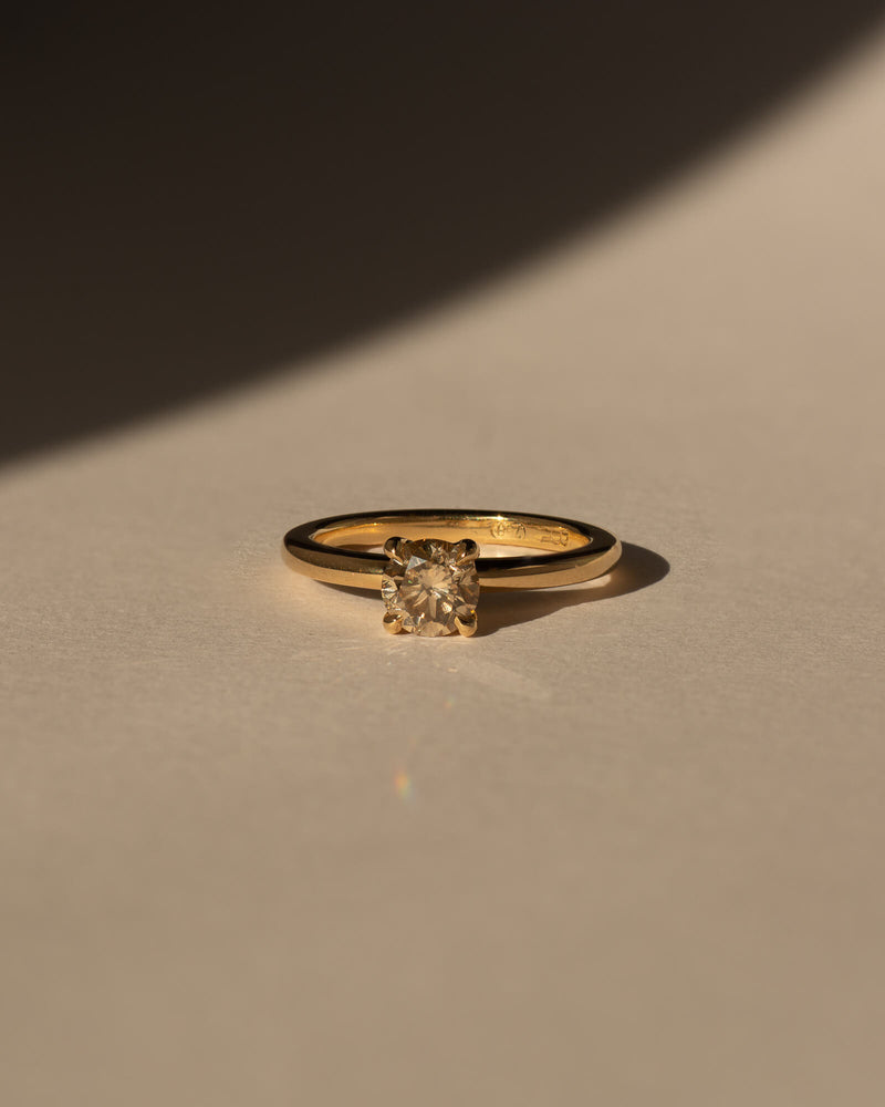 Bespoke round claw solitaire engagement ring in 18K yellow gold with 0.80ct natural champagne diamond — handcrafted by Benjamin Rose Melbourne