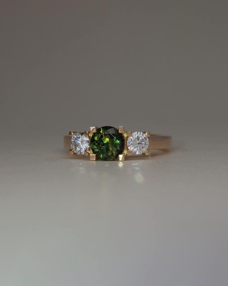 Bespoke square claw trilogy engagement ring in 18K yellow gold with 1.23ct round Australian sapphire and round brilliant lab diamond side stones — handcrafted by Benjamin Rose Melbourne