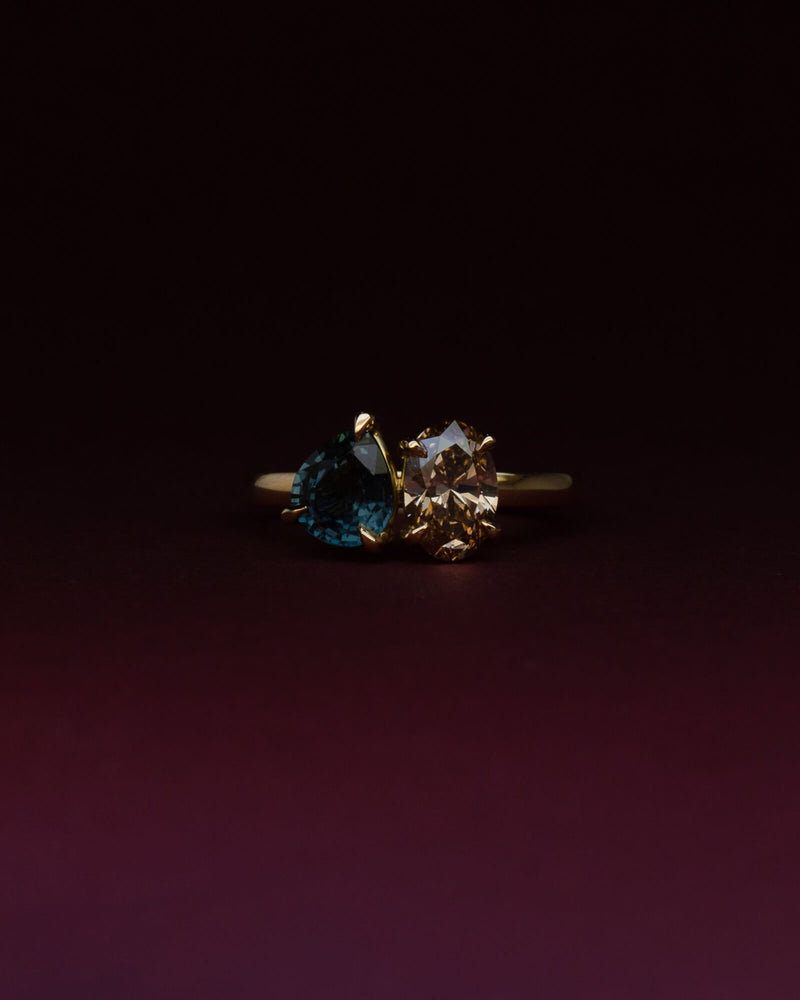 Bespoke toi et moi engagement ring in 18K yellow gold with pear Australian sapphire and oval champagne diamond — handcrafted by Benjamin Rose Melbourne