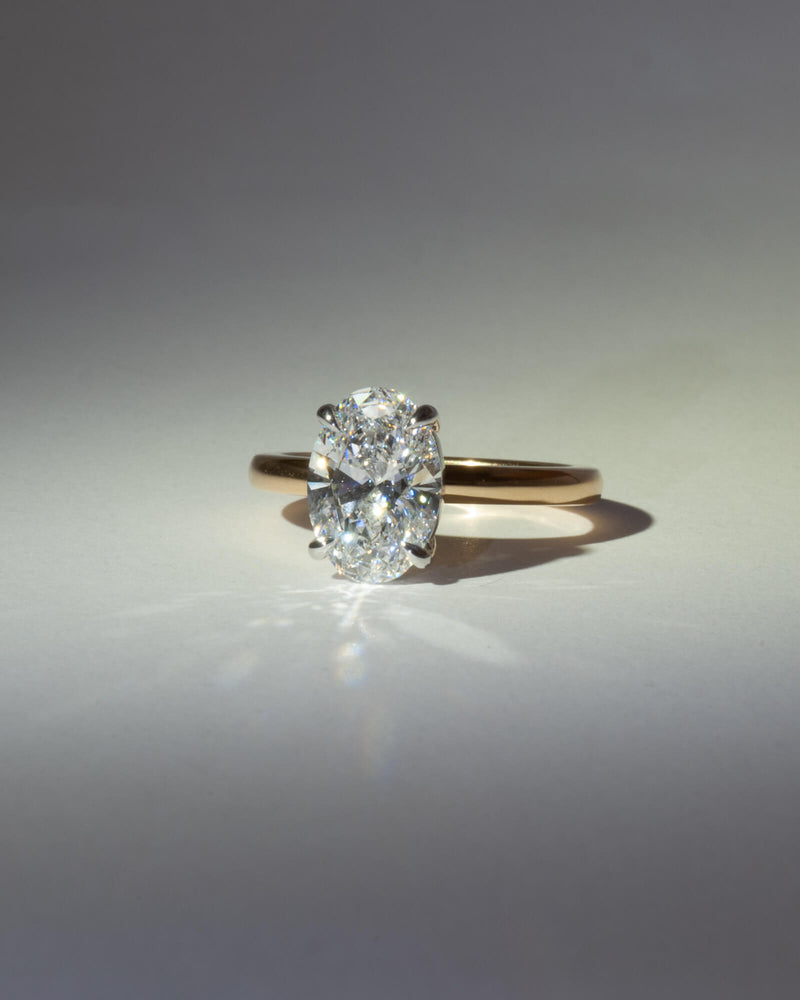 Bespoke oval solitaire engagement ring with 18K yellow gold band and white gold setting — 2.26ct lab grown diamond, handcrafted by Benjamin Rose Melbourne